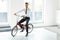 Young Businessman Rides on His Bike at Office. Business People