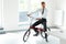 Young Businessman Rides on His Bike at Office. Business People