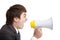 Young Businessman screaming by megaphone