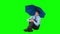 Young businessman sheltering with umbrella