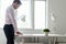 Young businessman standing at his desk reading a contract