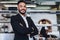 Young businessman standing in his restaurant