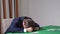 Young businessman in suit had lost last money savings in poker game, so he put head down on table in despair. Problems
