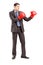 Young businessman in suit with red boxing gloves