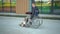 Young businessman in a suit in a wheelchair. A serious man is riding in a wheelchair against a business center. Special