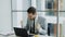 Young businessman using laptop computer receiving good message and become very excited and happy sits in modern office