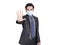 Young businessman wearing medical mask for protection, made  refusal gesture and said no, calling for close contact during covid-1