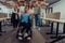 Young businessmen in a modern office extend a handshake to their business colleague in a wheelchair, showcasing