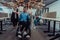 Young businessmen in a modern office extend a handshake to their business colleague in a wheelchair, showcasing