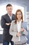 Young businesspeople standing in office