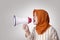 Young Businesswoman Angry, Screaming Using Megaphone