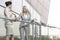 Young businesswoman arguing with female colleague at office balcony