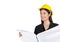 Young businesswoman in black suit, wearing a yellow construction helmet, unfolds the construction plan, looking out in the