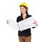 Young businesswoman in black suit, wearing a yellow construction helmet, unfolds the construction plan, looking out in the