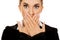 Young businesswoman covering with hand her mouth. Speak no evil concept