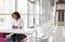 Young businesswoman at a desk working on her laptop