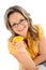 Young businesswoman eating orange