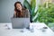 A young businesswoman enjoy listening to music to relieve stressed at work