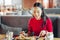 Young businesswoman enjoying her break while eating in restaurant