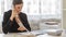 Young businesswoman, financial advisor or accountant, working at her office desk