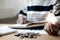 Young businesswoman holding a light bulb and coins or money arranged in steps, Saving money for business growth or long-term profi