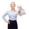 Young businesswoman holding money bags with euro
