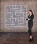 Young businesswoman looking at the labyrinth