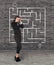 Young businesswoman looking at the labyrinth