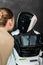 young businesswoman near humanoid robot in