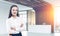 Young businesswoman near a wooden reception