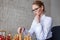 Young businesswoman playing chess in office