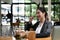 Young businesswoman pondering over ideas for new business project in meeting room.