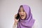 Young Businesswoman Shocked by Phone Call