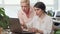 Young businesswoman showing her projects on the laptop to her female boss