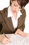 Young Businesswoman Signing a Document