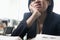 Young businesswoman sitting at desk bored