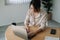 Young businesswoman sitting front open portable laptop computer reading email from client, long hours of work concept.