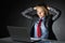 Young businesswoman sitting at office desk