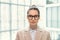 Young businesswoman standing at office