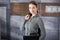 Young businesswoman standing in office lobby