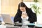 Young businesswoman suffering chest ache at office