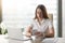 Young businesswoman using computer tablet at desk