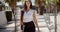 Young businesswoman walking through a park