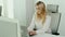 Young businesswoman is working on the computer in a bright office