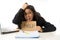 Young busy desperate Latin businesswoman holding help sign sitting at office desk in stress worried