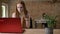 Young busy ginger woman is working with laptop in office, drinking coffee, work concept, communication concept