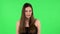 Young calm woman relaxing, meditating. Girl refuses stress and takes situation, calms down, breathes deeply. Greenscreen