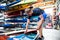 Young canoeist preparing canoe and paddle, going on water. Concept of canoeing as dynamic and adventurous sport.