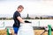 Young canoeist taking care of his canoe and paddle, cleaning, drying. Concept of canoeing as dynamic and adventurous