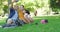 Young carefree family taking a selfie sitting in a park. Cheerful latin man taking a photo with his little daughter and